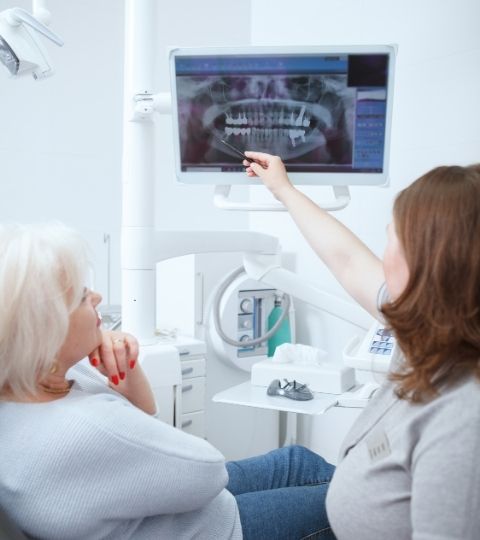 same-day dental implants in Manhattan consultation with a patient